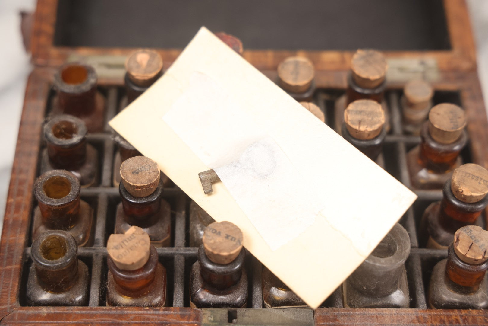 Lot 006 - Antique Traveling Apothecary Box Kit With Key, 24-Section Interior With 22 Bottles And 4 Smaller Bottles, Including Belladonna, Nux Vomica, Chamomilla, Arsenicum, And Tartarus Emeticus, Boericke & Tafel Homeopathic Pharmacy, New York & Chicago