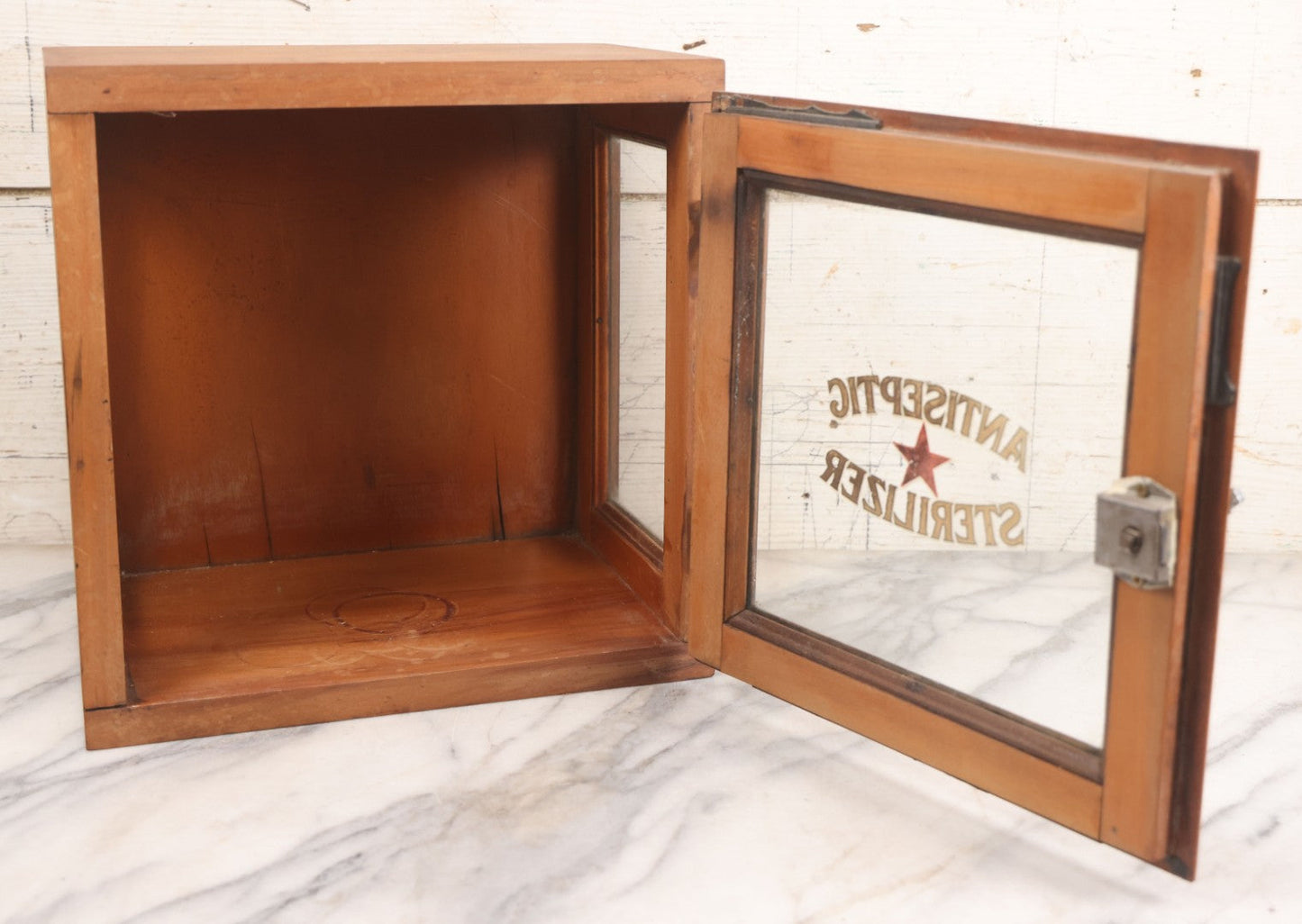 Lot 007 - Antique Wooden Antiseptic Sterilizer Cabinet With Glass Front Door And Reverse Painted Lettering, Red Star Logo, Glass Sides