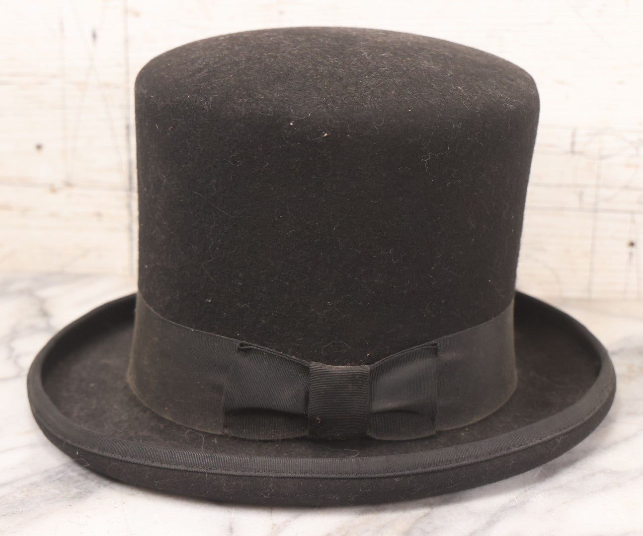 Lot 025 - Antique Black Wool Felt Top Hat With Grosgrain Ribbon Band And Bow, Early 20th Century