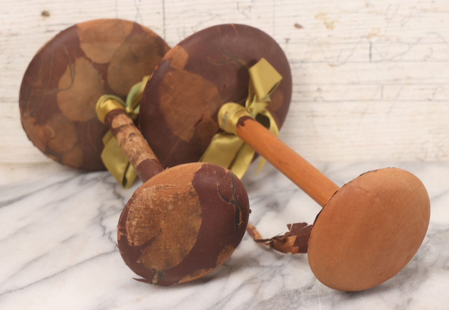 Lot 029 - Trio Of Vintage Hat Stands Including Two With Partial Fabric Coverings And Greenish-Yellow Ribbons, And One Blue Wire Stand With Felt Pillow