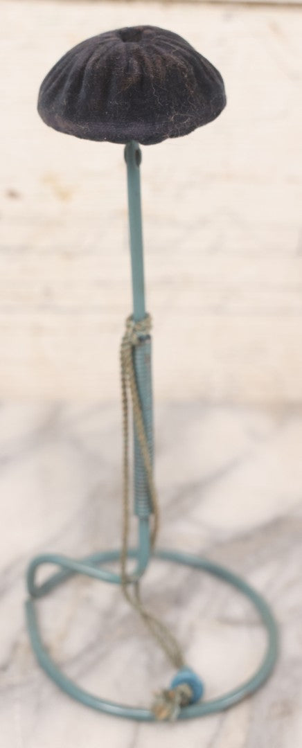 Lot 029 - Trio Of Vintage Hat Stands Including Two With Partial Fabric Coverings And Greenish-Yellow Ribbons, And One Blue Wire Stand With Felt Pillow