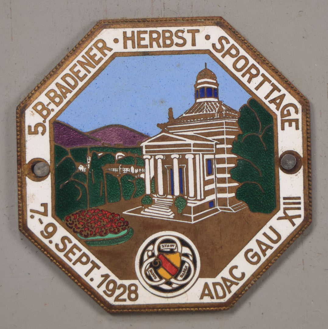 Lot 033 - Vintage Custom Cut Wooden Plaque With Five Metal Car Club Badges Including United States Flag, Austria Österreich, Shriners, A.D.A.C. 1928 Baden Sporttage, And Österreichischen Automobil-Club, 5-1/2" x 20-1/4"