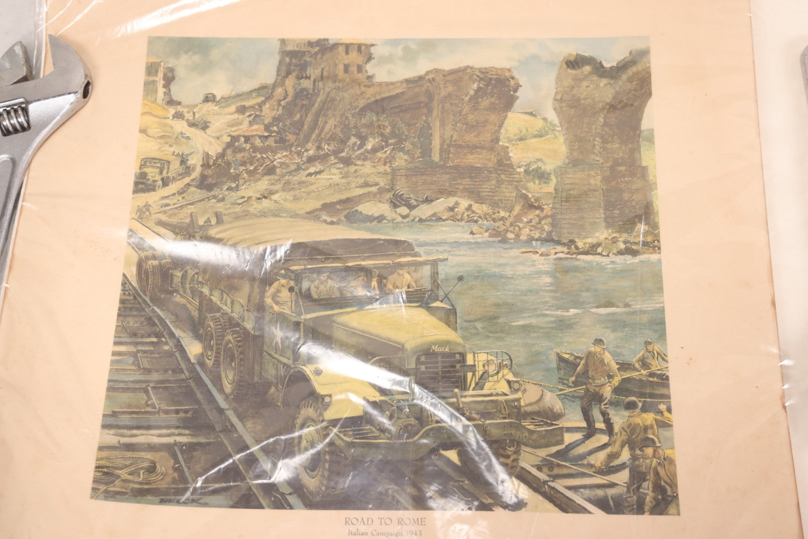 Lot 035 - World War II Mack Trucks Advertising Poster “Road To Rome, Italian Campaign 1943” Depicting Military Transport Crossing Bridge, Illustrated By Peter Helck, Unframed, 19-1/2" x 18-3/4"