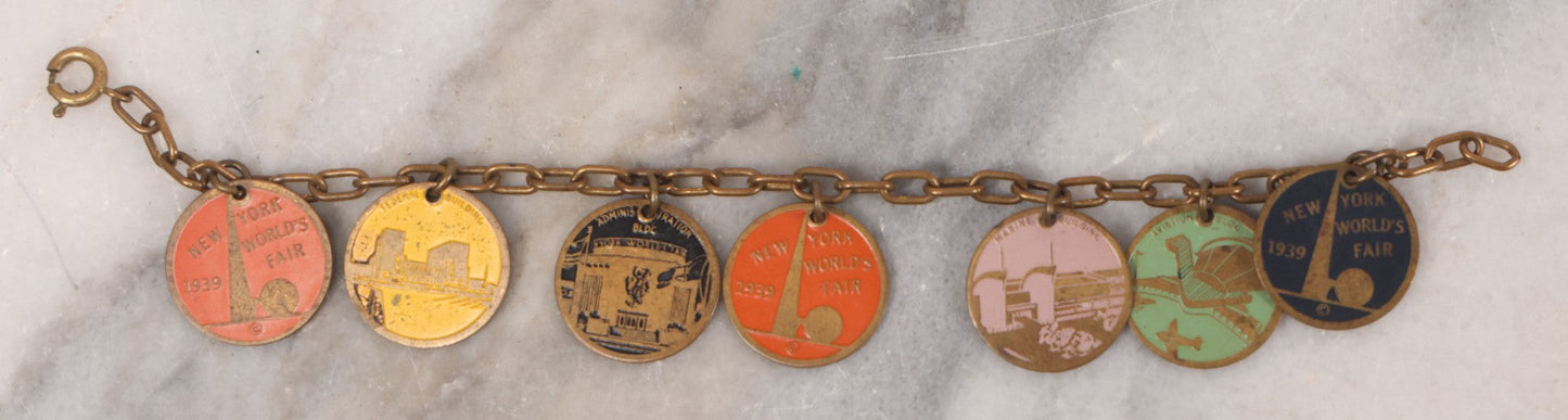 Lot 038 - Vintage Brass Chain Link Charm Bracelet With Six Enameled Souvenir Charms From The New York World's Fair 1939 Including Trylon And Perisphere And Landmark Buildings, 7" Length