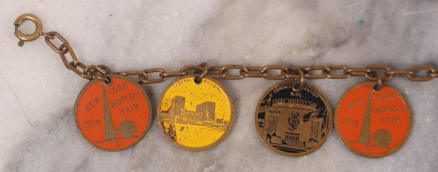 Lot 038 - Vintage Brass Chain Link Charm Bracelet With Six Enameled Souvenir Charms From The New York World's Fair 1939 Including Trylon And Perisphere And Landmark Buildings, 7" Length