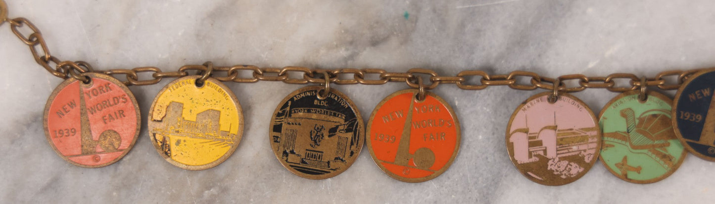 Lot 038 - Vintage Brass Chain Link Charm Bracelet With Six Enameled Souvenir Charms From The New York World's Fair 1939 Including Trylon And Perisphere And Landmark Buildings, 7" Length