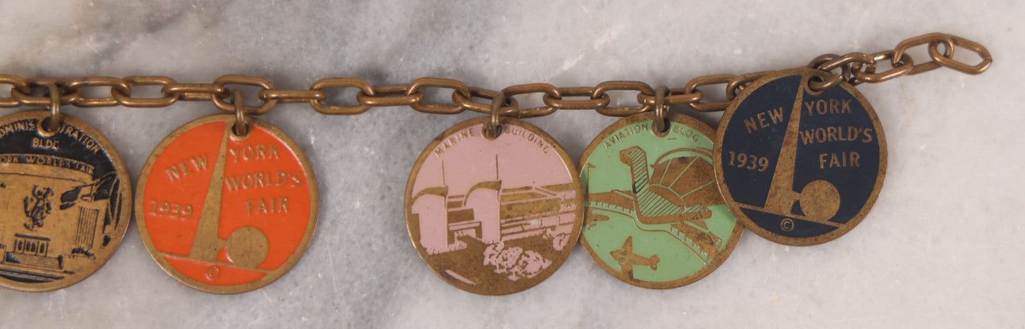 Lot 038 - Vintage Brass Chain Link Charm Bracelet With Six Enameled Souvenir Charms From The New York World's Fair 1939 Including Trylon And Perisphere And Landmark Buildings, 7" Length