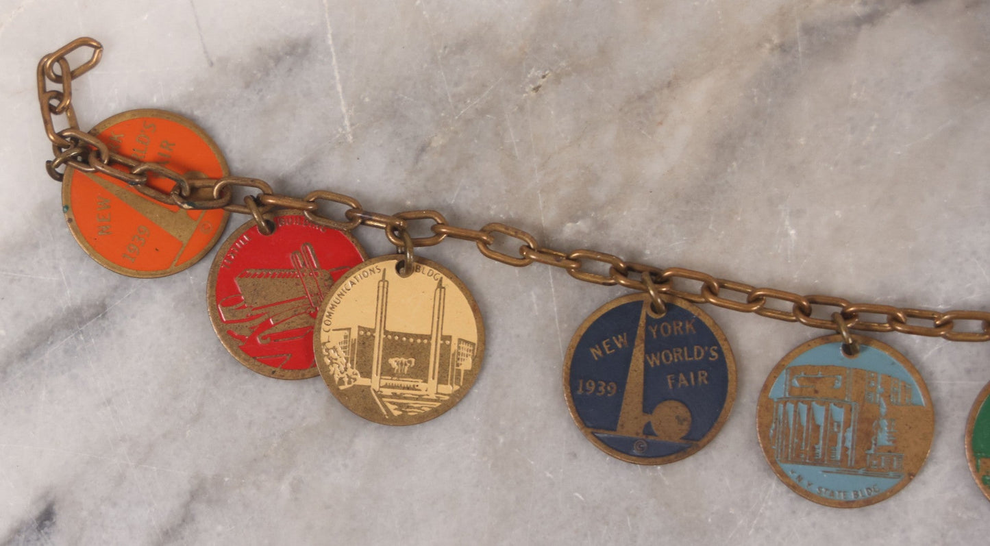 Lot 038 - Vintage Brass Chain Link Charm Bracelet With Six Enameled Souvenir Charms From The New York World's Fair 1939 Including Trylon And Perisphere And Landmark Buildings, 7" Length