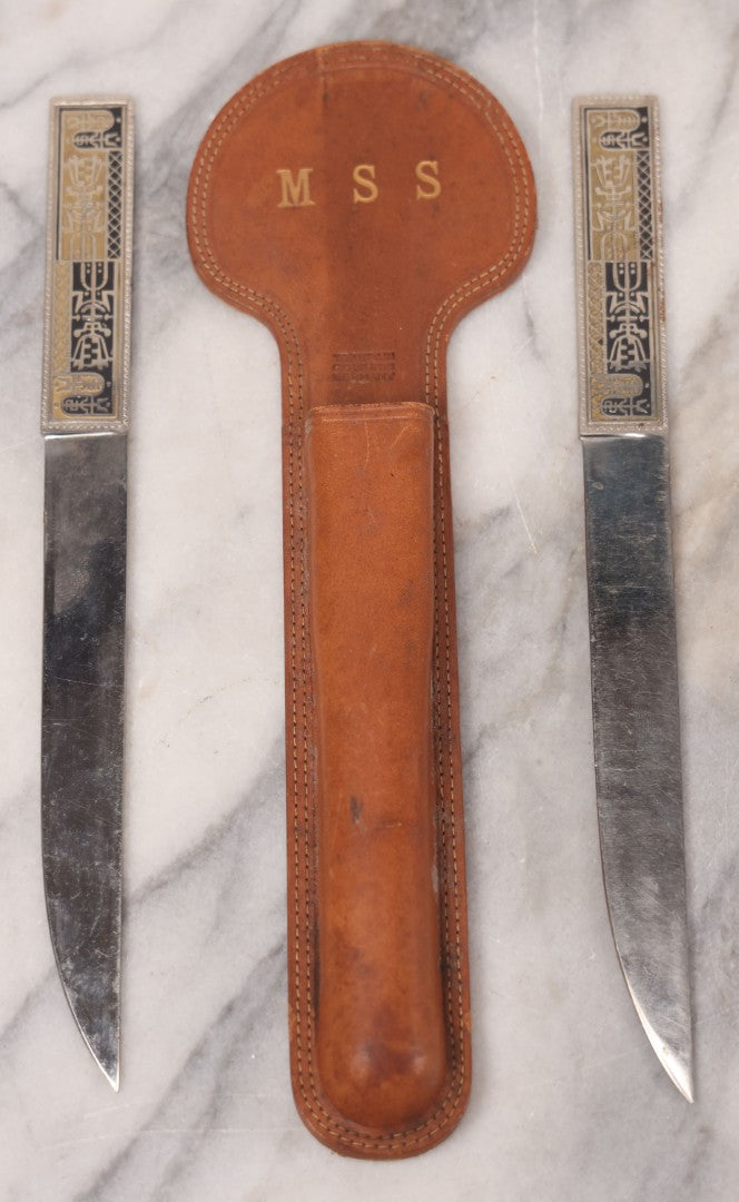 Lot 039 - Pair Of Vintage German Stainless Steel Letter Openers With Eastern-Influenced Enameled Geometric Design In Monogrammed Leather Sheath
