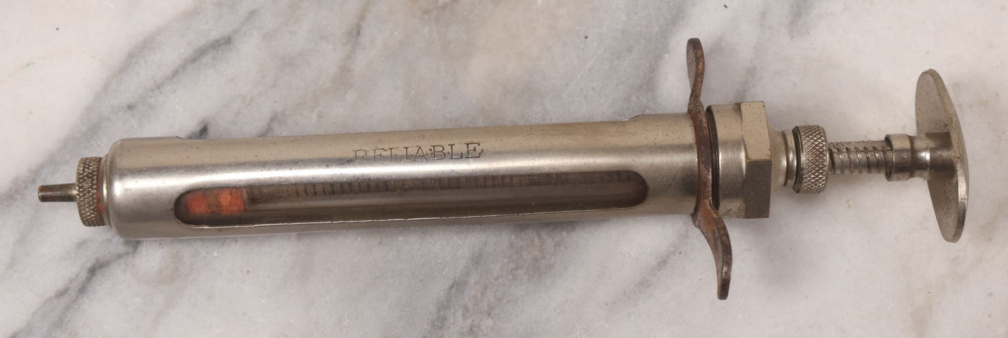 Lot 045 - Antique “Reliable” Brand Syringe No. 3 With Metal Body And Glass Center Tube, With Box Of Vintage B.D. Needles