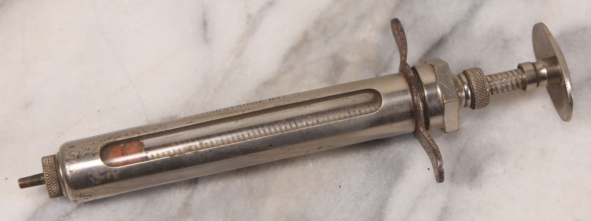 Lot 045 - Antique “Reliable” Brand Syringe No. 3 With Metal Body And Glass Center Tube, With Box Of Vintage B.D. Needles