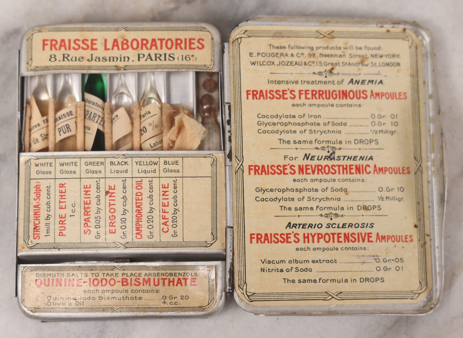 Lot 046 - Antique French Tin “Emergency Medical Pocket” By Fraisse Laboratories, Paris, With Five Glass Ampules, Pill Vial, And Original Paper Inserts