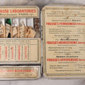 Lot 046 - Antique French Tin “Emergency Medical Pocket” By Fraisse Laboratories, Paris, With Five Glass Ampules, Pill Vial, And Original Paper Inserts