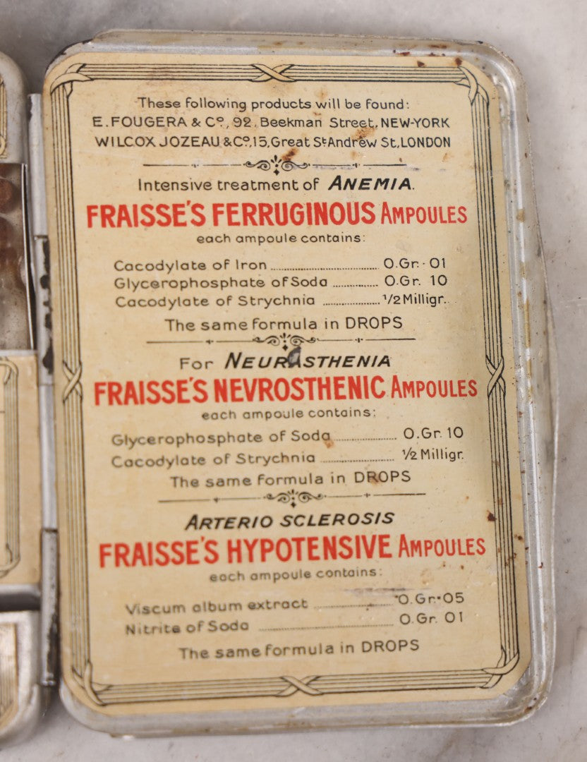 Lot 046 - Antique French Tin “Emergency Medical Pocket” By Fraisse Laboratories, Paris, With Five Glass Ampules, Pill Vial, And Original Paper Inserts