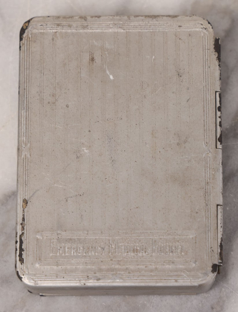 Lot 046 - Antique French Tin “Emergency Medical Pocket” By Fraisse Laboratories, Paris, With Five Glass Ampules, Pill Vial, And Original Paper Inserts