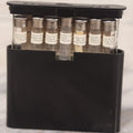 Lot 047 - Vintage Eli Lilly Bakelite Vial Holder With Seven Glass Vials With Paper Labels Including Amytal Compounds, With Paper Insert