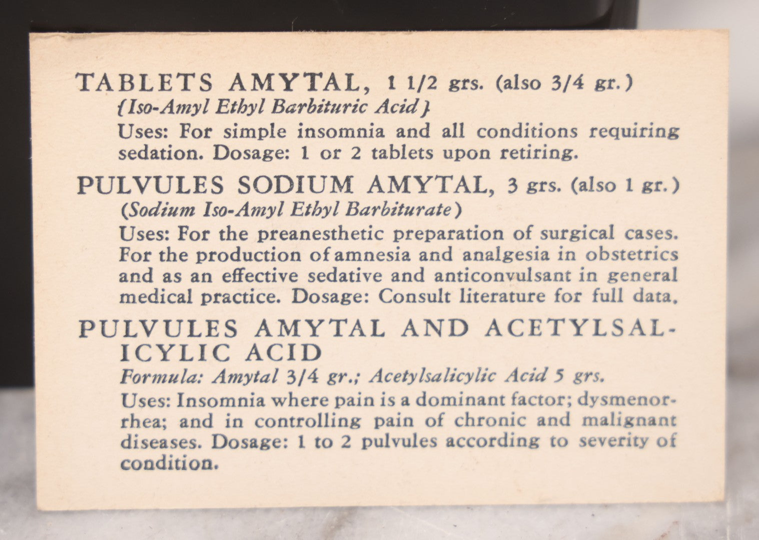 Lot 047 - Vintage Eli Lilly Bakelite Vial Holder With Seven Glass Vials With Paper Labels Including Amytal Compounds, With Paper Insert