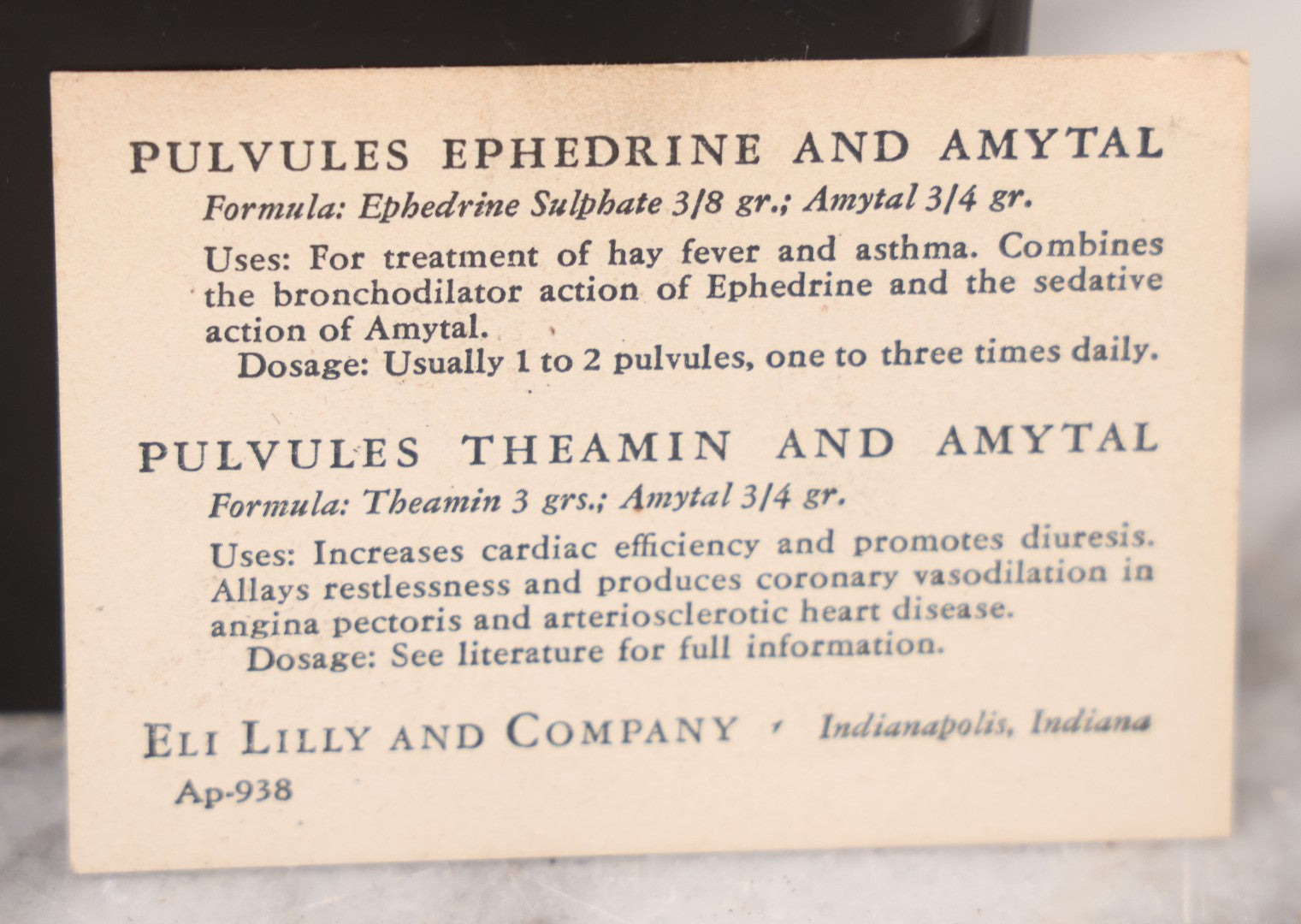 Lot 047 - Vintage Eli Lilly Bakelite Vial Holder With Seven Glass Vials With Paper Labels Including Amytal Compounds, With Paper Insert