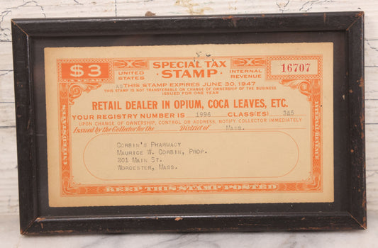 Lot 048 - Vintage Framed U.S. Internal Revenue Special Tax Stamp For Retail Dealer In Opium And Coca Leaves, Corbin's Pharmacy, Worcester, Massachusetts, Expiring June 30, 1947, 7-5/8" x 4-3/4"