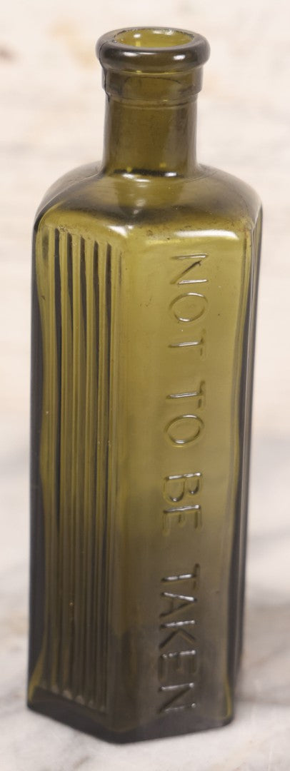 Lot 051 - Antique J. Lumb & Co. Ltd. Green Glass Poison Bottle With Embossed Lettering “Not To Be Taken,” Vertical Poison Ribs, 8 Oz. Size, Castleford, Yorkshire, England, Circa 1880s, 6-5/8" H