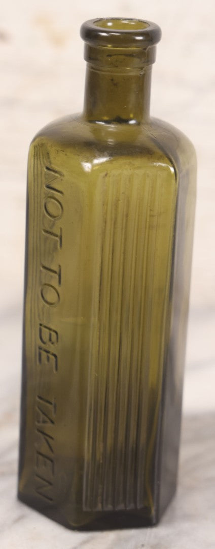 Lot 051 - Antique J. Lumb & Co. Ltd. Green Glass Poison Bottle With Embossed Lettering “Not To Be Taken,” Vertical Poison Ribs, 8 Oz. Size, Castleford, Yorkshire, England, Circa 1880s, 6-5/8" H