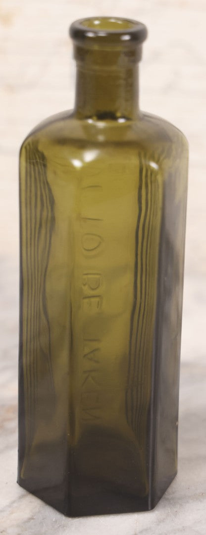 Lot 051 - Antique J. Lumb & Co. Ltd. Green Glass Poison Bottle With Embossed Lettering “Not To Be Taken,” Vertical Poison Ribs, 8 Oz. Size, Castleford, Yorkshire, England, Circa 1880s, 6-5/8" H