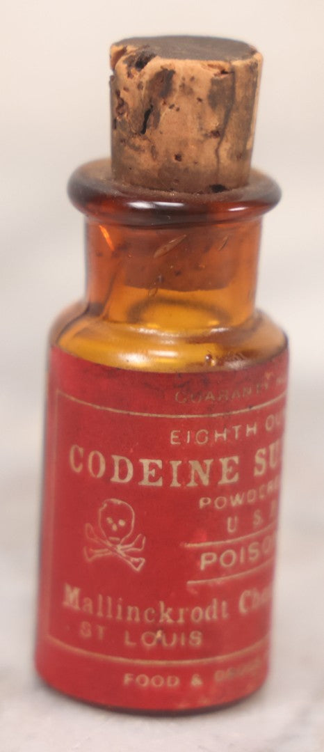 Lot 053 - Antique Mallinckrodt Chemical Works “Codeine Sulfate” Powder U.S.P. Amber Glass Bottle With Red Poison Label Featuring Skull And Crossbones, 1/8 Oz. Size, St. Louis & New York, Marked Food And Drugs Act 1906, 2-5/8" H