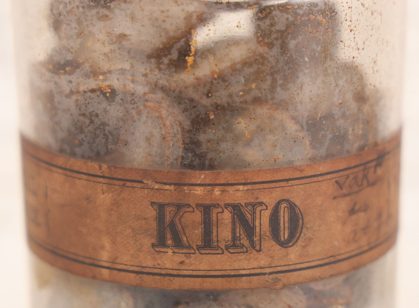 Lot 058 - Antique Apothecary Bottle With Original Paper Label “Kino, London Hospital Throat Lozenges” With Contents, Clear Glass Bottle With Stopper Manufactured By George C. Frye, Portland, Maine, 8" H