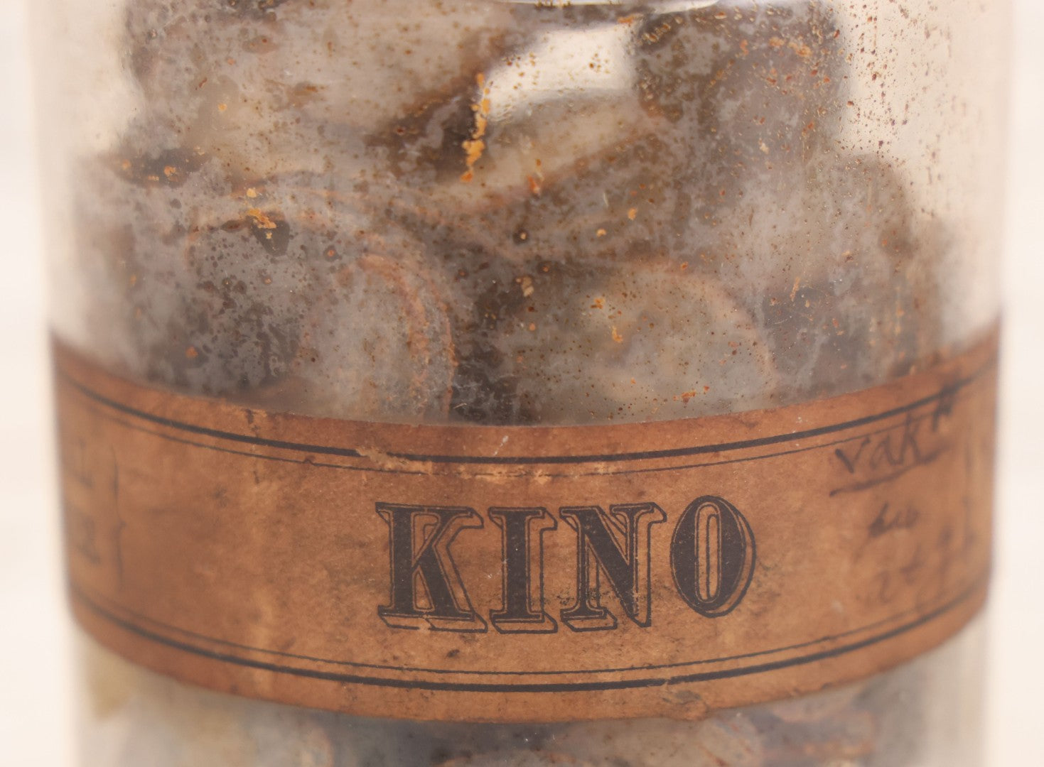 Lot 058 - Antique Apothecary Bottle With Original Paper Label “Kino, London Hospital Throat Lozenges” With Contents, Clear Glass Bottle With Stopper Manufactured By George C. Frye, Portland, Maine, 8" H