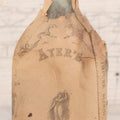 Lot 059 - Antique Ayer's Clear Glass Bottle With Partial Paper Label Wrapper And Embossed Base, 7-1/2" H