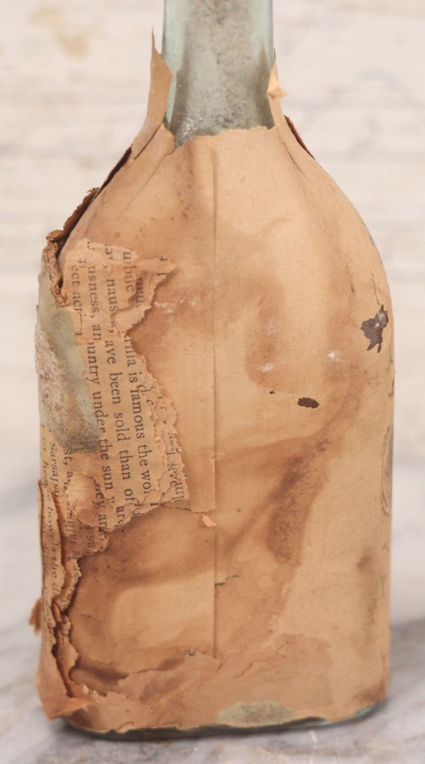 Lot 059 - Antique Ayer's Clear Glass Bottle With Partial Paper Label Wrapper And Embossed Base, 7-1/2" H