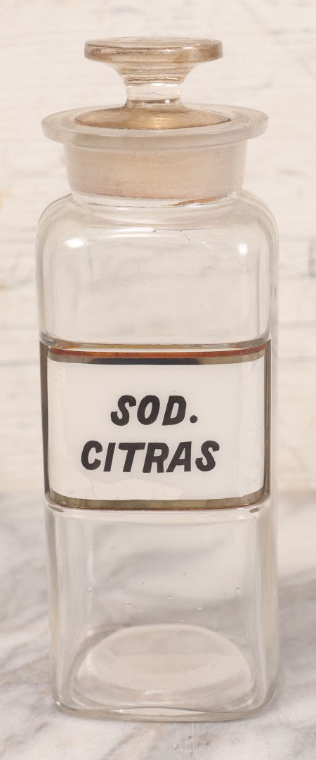 Lot 061 - Antique Whitall Tatum Co. Clear Glass Apothecary Bottle With Stopper And Reverse Painted Label “Sod. Citras”, 7-3/4" H