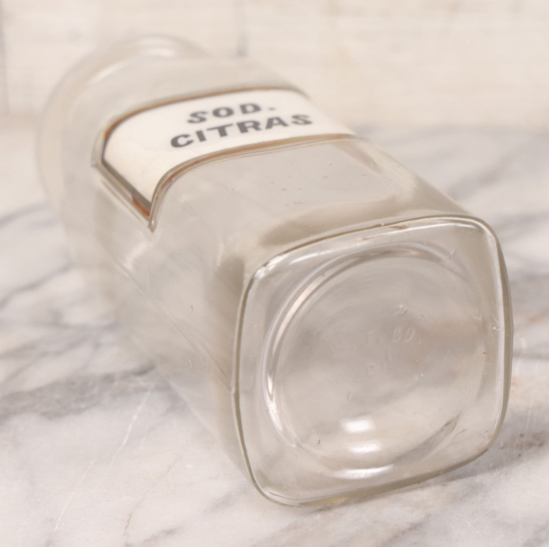 Lot 061 - Antique Whitall Tatum Co. Clear Glass Apothecary Bottle With Stopper And Reverse Painted Label “Sod. Citras”, 7-3/4" H