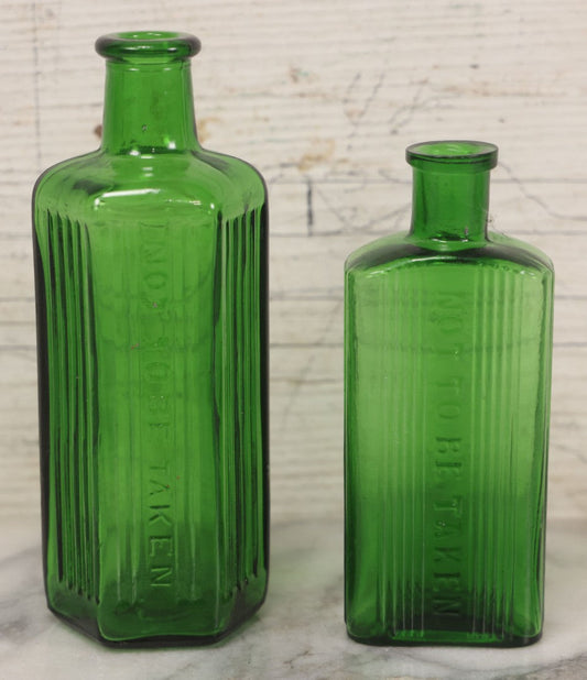 Lot 063 - Pair Of Antique Green Glass Poison Bottles With Embossed Lettering “Not To Be Taken,” Vertical Poison Ribs, Including Hexagonal 8Oz And Rectangular 4 Oz Sizes