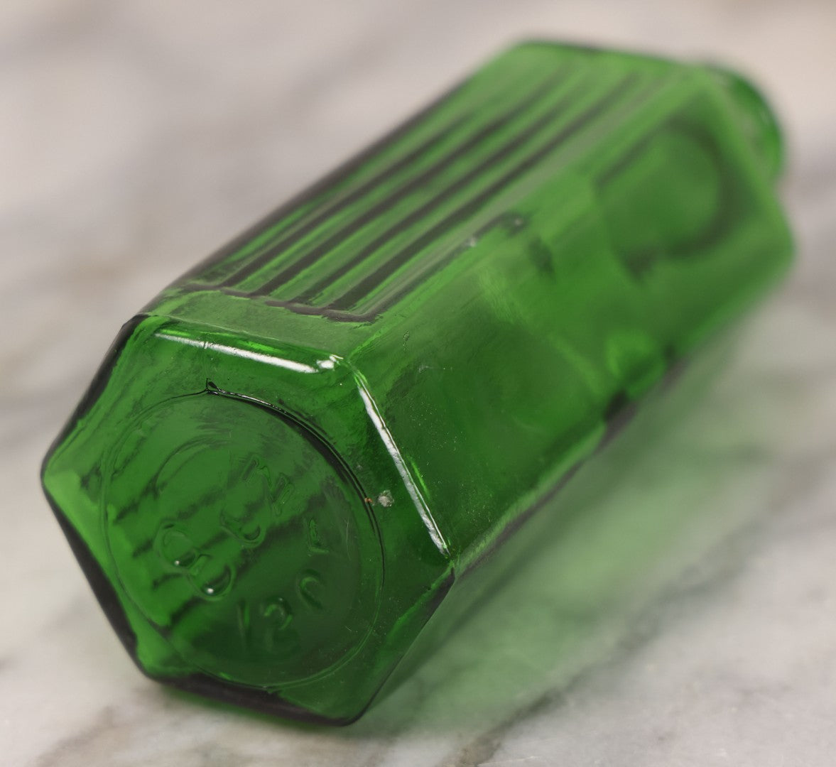 Lot 063 - Pair Of Antique Green Glass Poison Bottles With Embossed Lettering “Not To Be Taken,” Vertical Poison Ribs, Including Hexagonal 8Oz And Rectangular 4 Oz Sizes