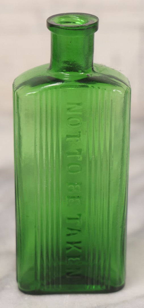 Lot 063 - Pair Of Antique Green Glass Poison Bottles With Embossed Lettering “Not To Be Taken,” Vertical Poison Ribs, Including Hexagonal 8Oz And Rectangular 4 Oz Sizes