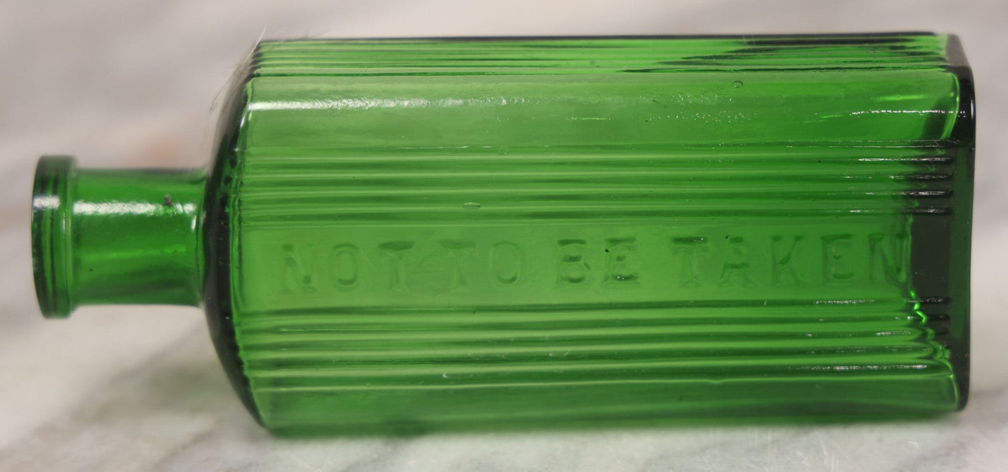Lot 063 - Pair Of Antique Green Glass Poison Bottles With Embossed Lettering “Not To Be Taken,” Vertical Poison Ribs, Including Hexagonal 8Oz And Rectangular 4 Oz Sizes