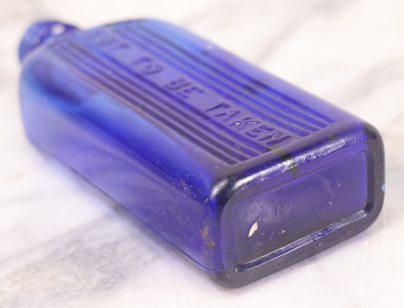 Lot 064 - Grouping Of Three Antique Cobalt Blue Glass Poison Bottles With Embossed Lettering “Not To Be Taken,” Rectangular Form With Vertical Poison Ribs, Three Sizes