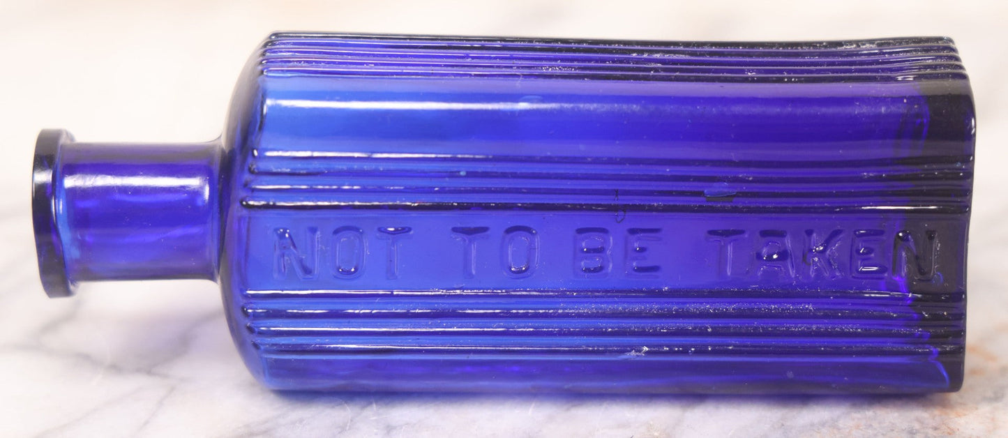 Lot 064 - Grouping Of Three Antique Cobalt Blue Glass Poison Bottles With Embossed Lettering “Not To Be Taken,” Rectangular Form With Vertical Poison Ribs, Three Sizes