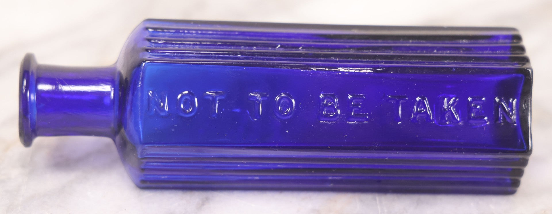 Lot 065 - Grouping Of Three Antique Cobalt Blue Glass Poison Bottles With Embossed Lettering “Not To Be Taken,” Hexagonal Form With Vertical Poison Ribs, Two 2Oz And One 3Oz, 3Oz Marked Y.C. Co.