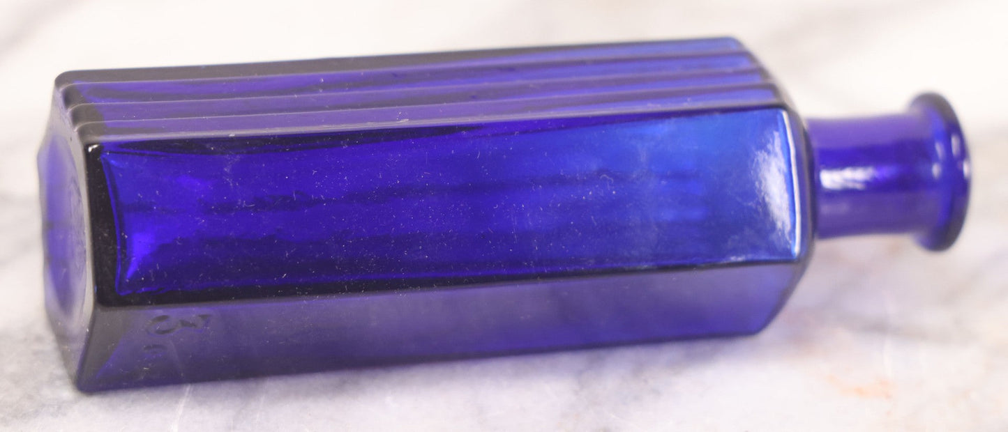 Lot 065 - Grouping Of Three Antique Cobalt Blue Glass Poison Bottles With Embossed Lettering “Not To Be Taken,” Hexagonal Form With Vertical Poison Ribs, Two 2Oz And One 3Oz, 3Oz Marked Y.C. Co.