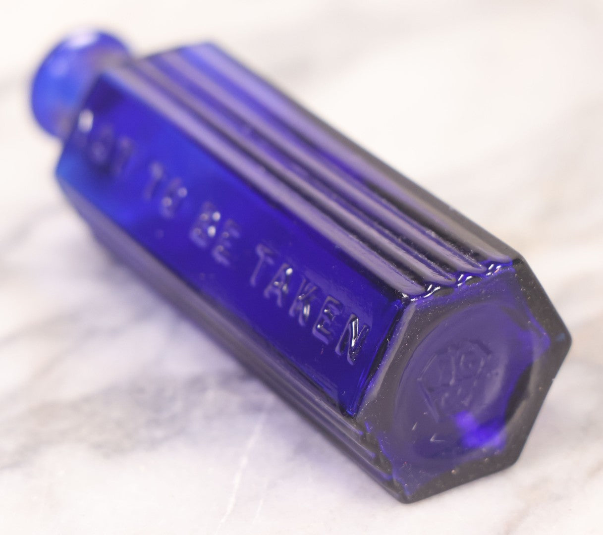 Lot 065 - Grouping Of Three Antique Cobalt Blue Glass Poison Bottles With Embossed Lettering “Not To Be Taken,” Hexagonal Form With Vertical Poison Ribs, Two 2Oz And One 3Oz, 3Oz Marked Y.C. Co.