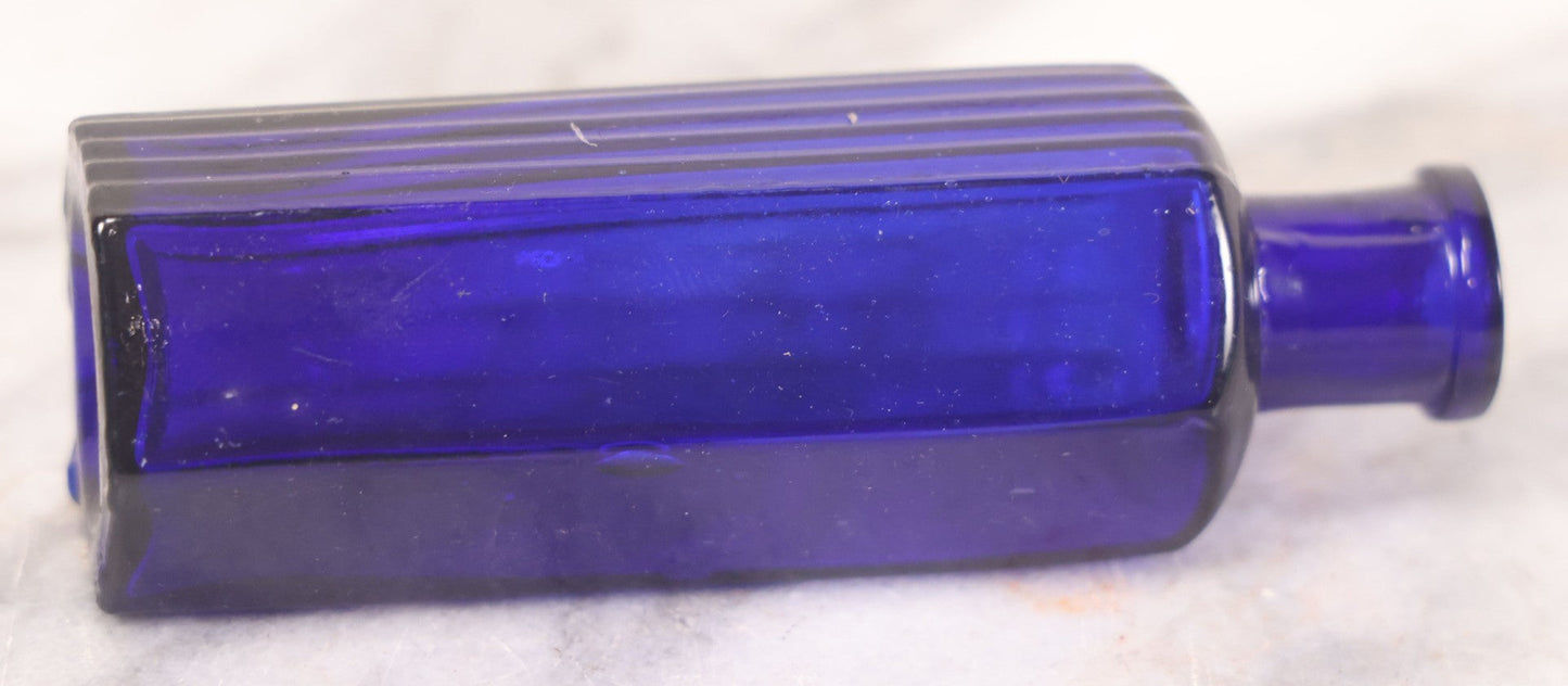 Lot 065 - Grouping Of Three Antique Cobalt Blue Glass Poison Bottles With Embossed Lettering “Not To Be Taken,” Hexagonal Form With Vertical Poison Ribs, Two 2Oz And One 3Oz, 3Oz Marked Y.C. Co.