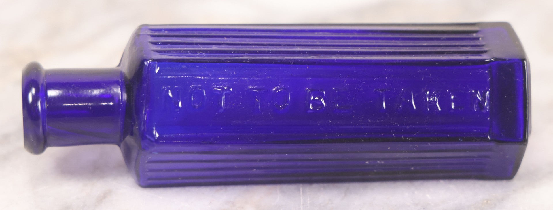 Lot 065 - Grouping Of Three Antique Cobalt Blue Glass Poison Bottles With Embossed Lettering “Not To Be Taken,” Hexagonal Form With Vertical Poison Ribs, Two 2Oz And One 3Oz, 3Oz Marked Y.C. Co.