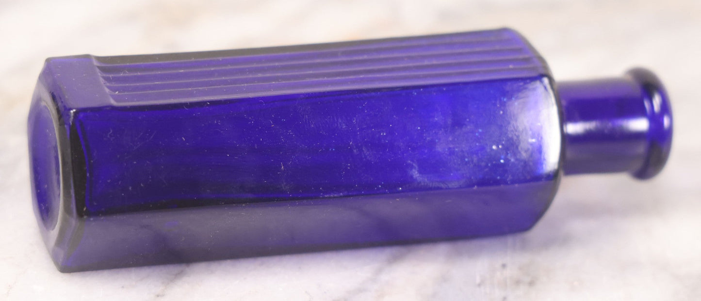 Lot 065 - Grouping Of Three Antique Cobalt Blue Glass Poison Bottles With Embossed Lettering “Not To Be Taken,” Hexagonal Form With Vertical Poison Ribs, Two 2Oz And One 3Oz, 3Oz Marked Y.C. Co.