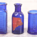 Lot 066 - Grouping Of Three Antique Cobalt Blue Glass Poison Bottles, Including Embossed “Poison” With Horizontal Ribs, Embossed “Wyeth Poison” Without Ribs, And Whitall Tatum Co. Bottle With Partial Paper Label