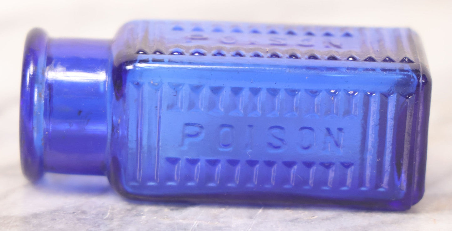 Lot 066 - Grouping Of Three Antique Cobalt Blue Glass Poison Bottles, Including Embossed “Poison” With Horizontal Ribs, Embossed “Wyeth Poison” Without Ribs, And Whitall Tatum Co. Bottle With Partial Paper Label