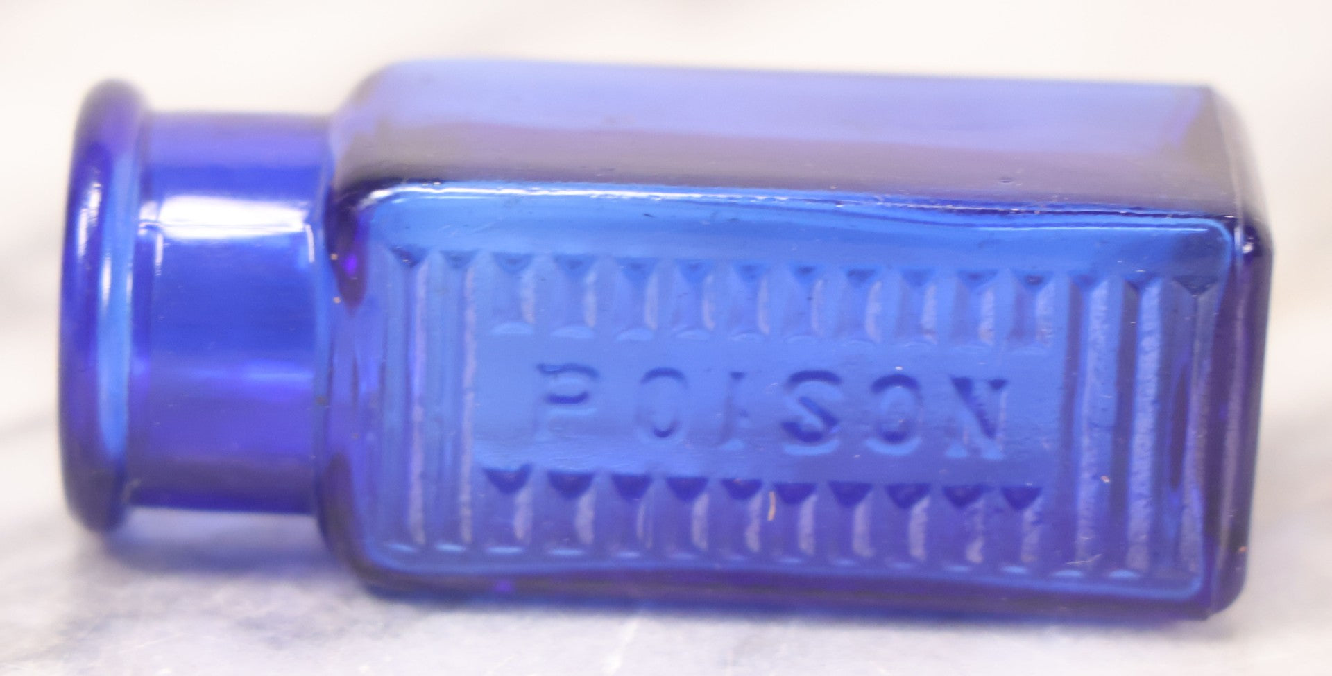 Lot 066 - Grouping Of Three Antique Cobalt Blue Glass Poison Bottles, Including Embossed “Poison” With Horizontal Ribs, Embossed “Wyeth Poison” Without Ribs, And Whitall Tatum Co. Bottle With Partial Paper Label