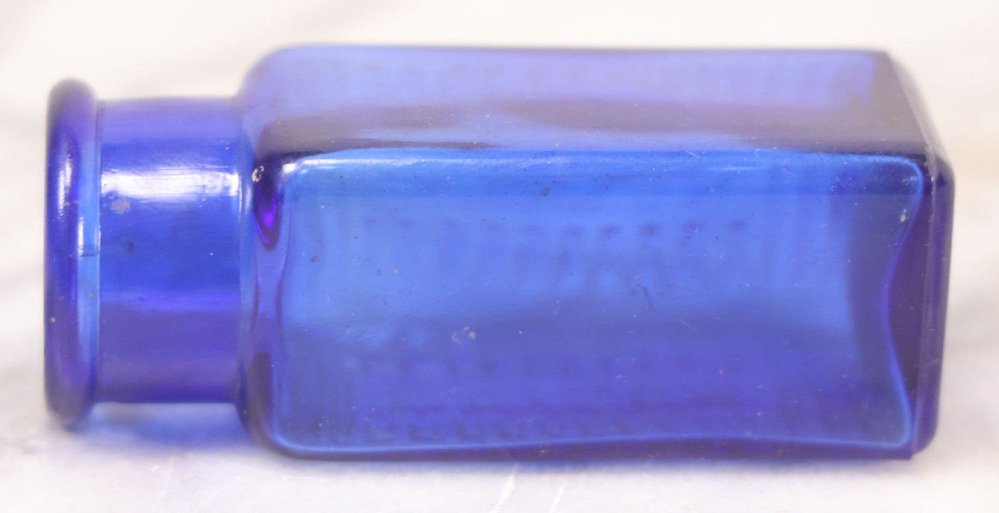 Lot 066 - Grouping Of Three Antique Cobalt Blue Glass Poison Bottles, Including Embossed “Poison” With Horizontal Ribs, Embossed “Wyeth Poison” Without Ribs, And Whitall Tatum Co. Bottle With Partial Paper Label