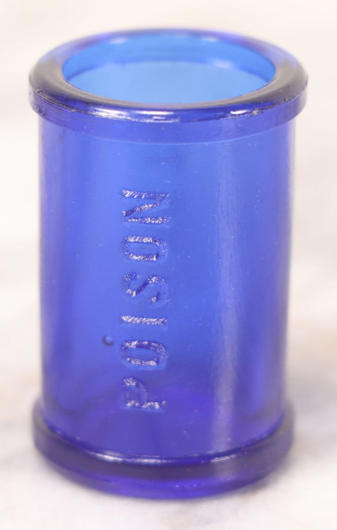 Lot 066 - Grouping Of Three Antique Cobalt Blue Glass Poison Bottles, Including Embossed “Poison” With Horizontal Ribs, Embossed “Wyeth Poison” Without Ribs, And Whitall Tatum Co. Bottle With Partial Paper Label